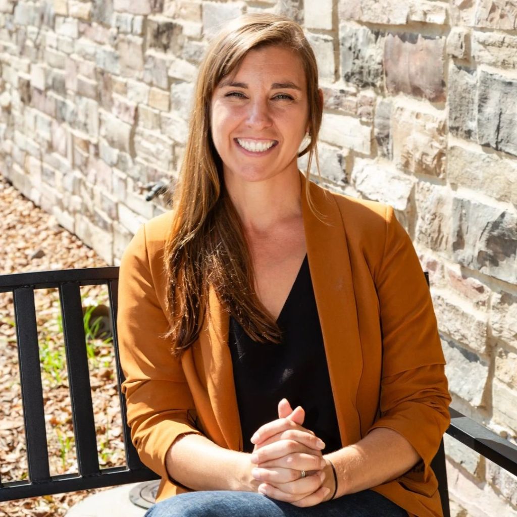 Cori smiling on the porch. Her sweet spirit creates a relaxed atmosphere, allowing you to learn at your own pace.